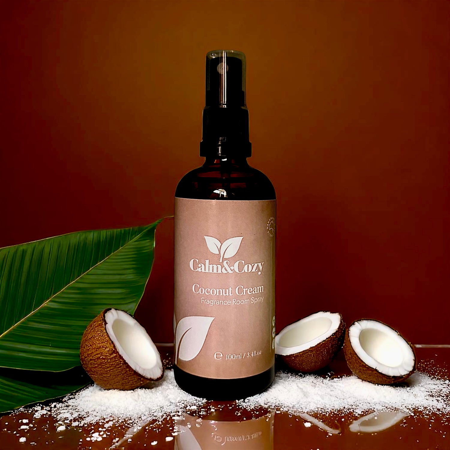 Bottle of Calm & Cozy Coconut Cream product with coconut halves and a leaf on a wooden surface.