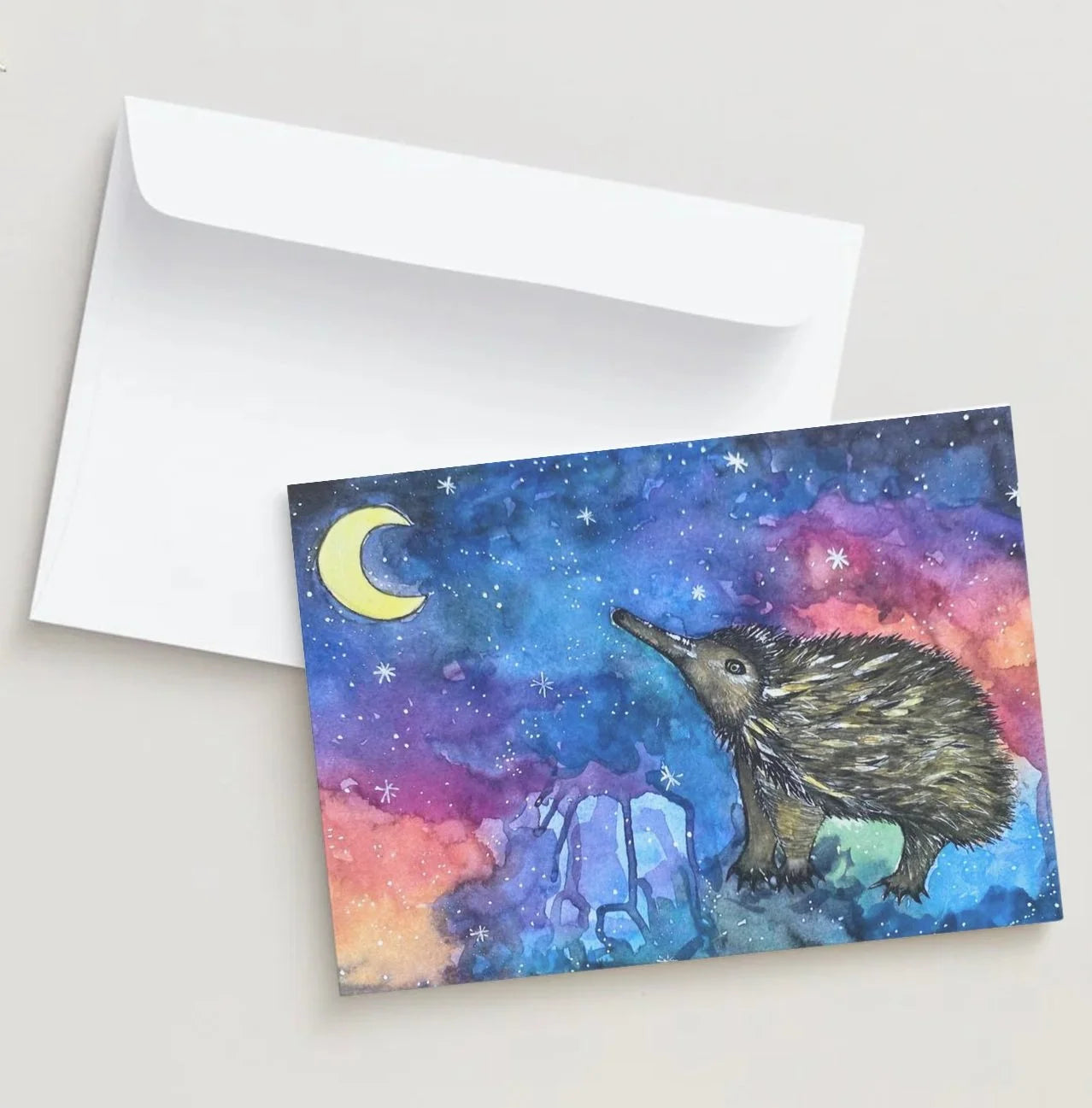 Greeting card with a kiwi bird and galaxy design on a white background