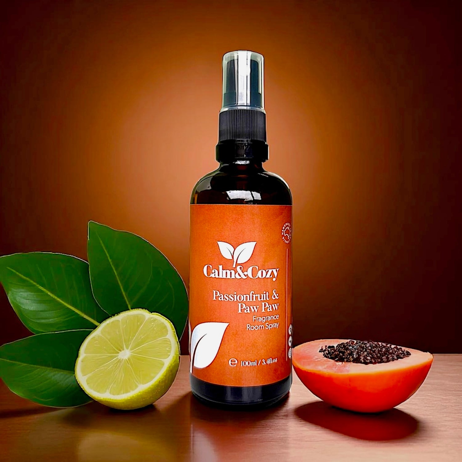 Calm & Cozy bottle with passionfruit and paw paw on a wooden surface