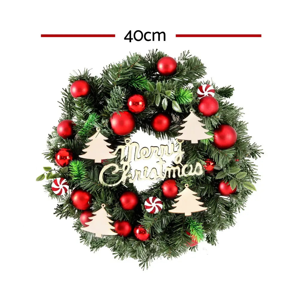 Festive Jingle Jollys Christmas Wreath with red baubles and wooden trees decor