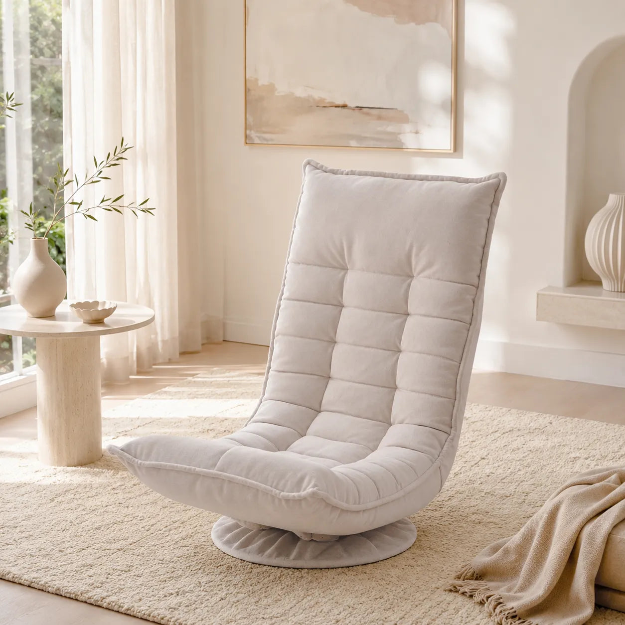 A light beige upholstered swivel lounge chair with a high tufted backrest, shown in a bright, modern room with a rug, side table, and neutral decor.