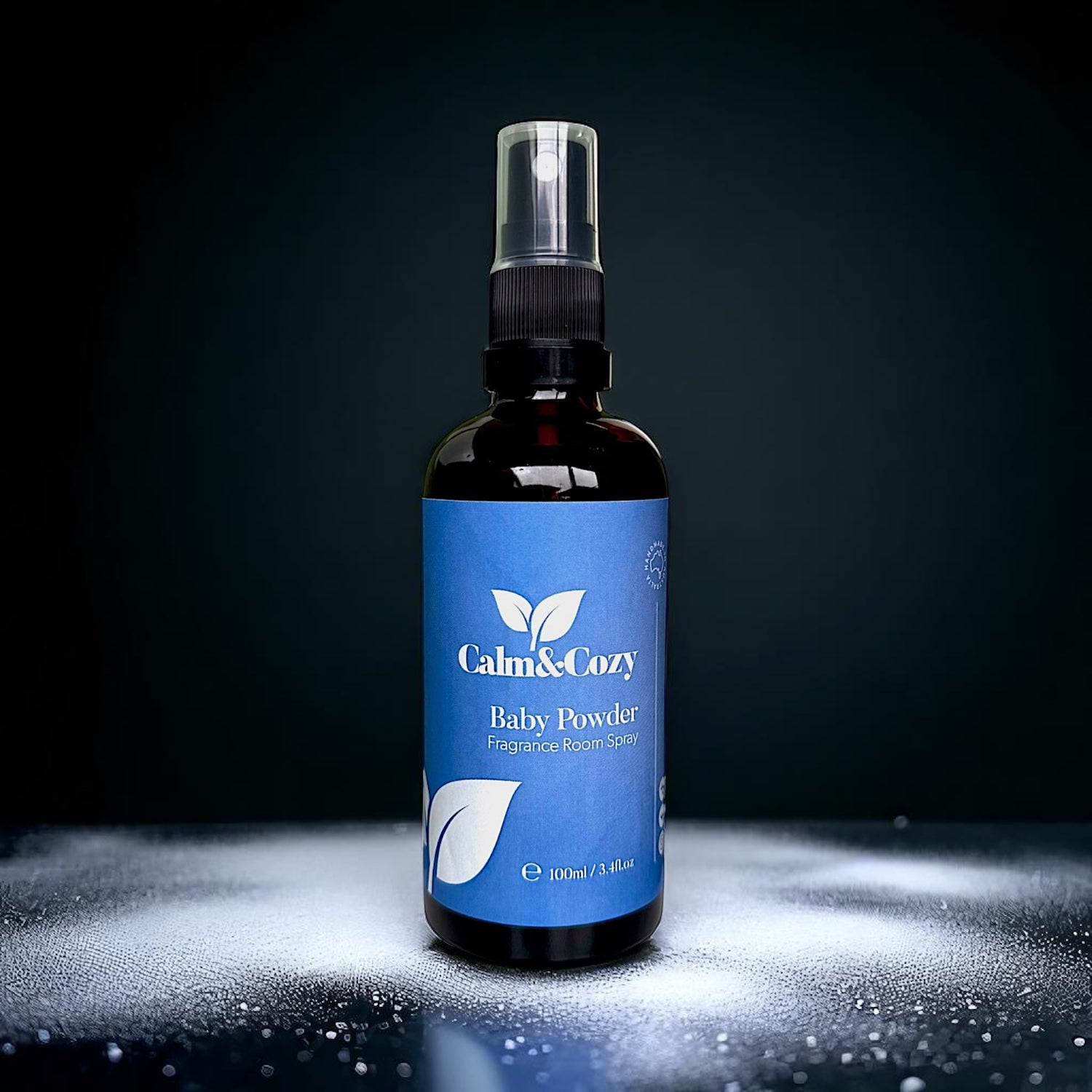 Baby powder spray bottle with blue label on a dark background