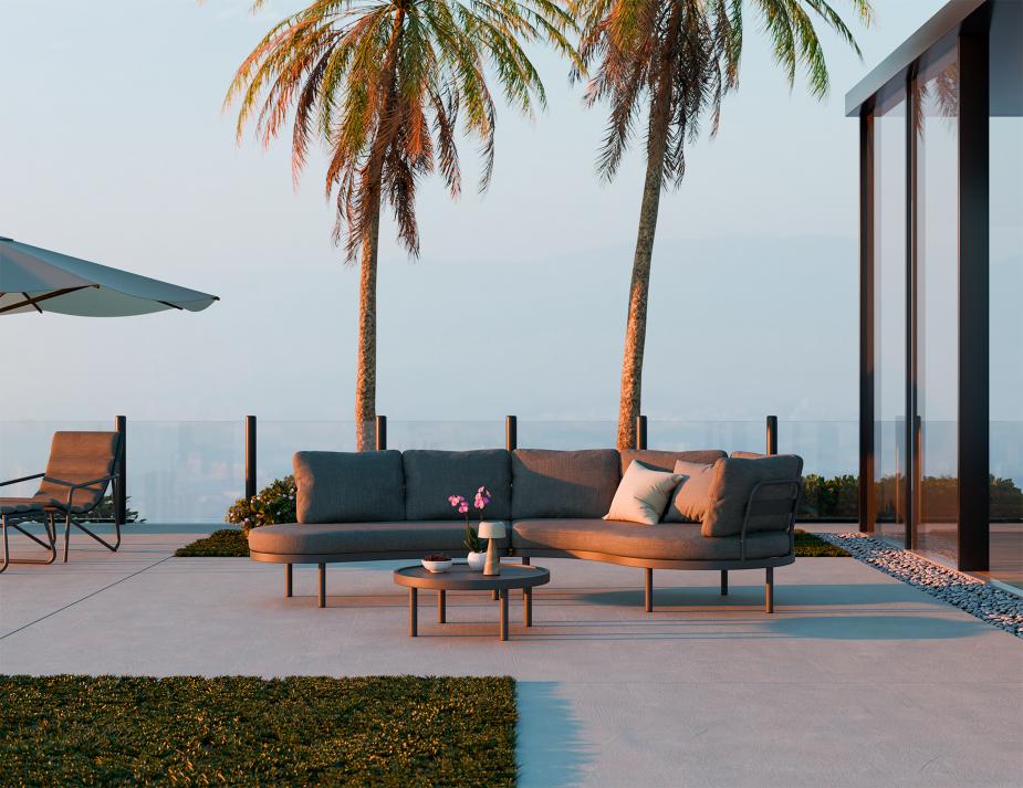 Outdoor patio with modern sofa set, umbrella, and palm trees