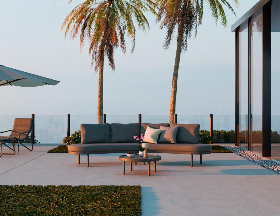 Outdoor patio with a sofa, coffee table, and chairs under palm trees.