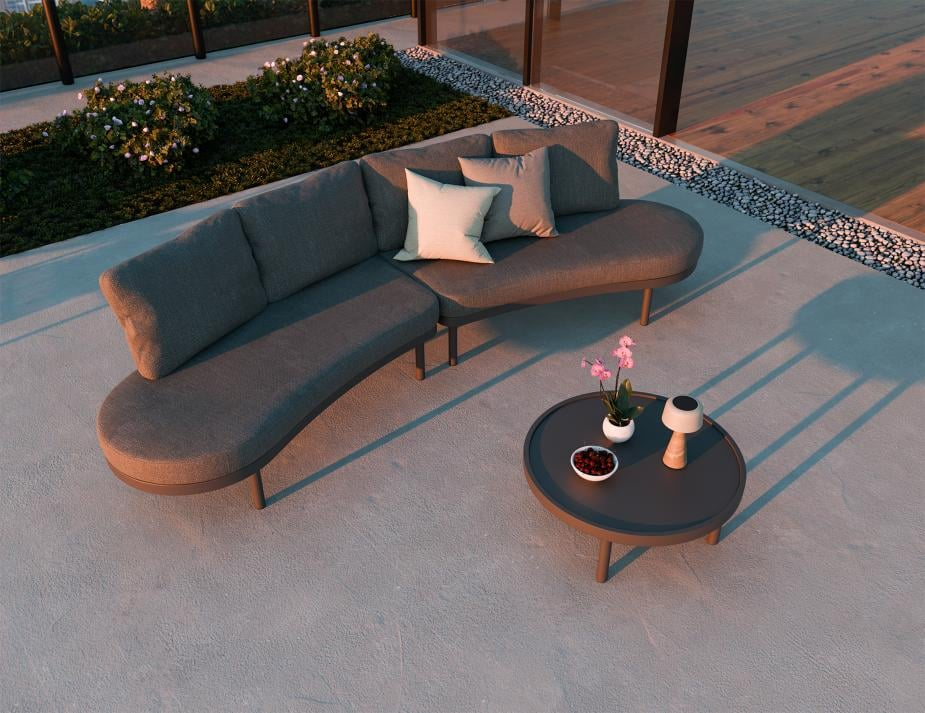 Modern outdoor sofa set with a small round table on a patio