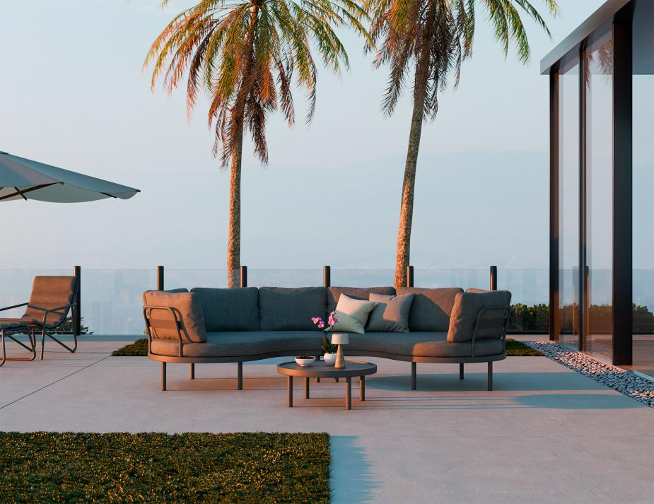 Modern outdoor sofa set with palm trees and a clear sky