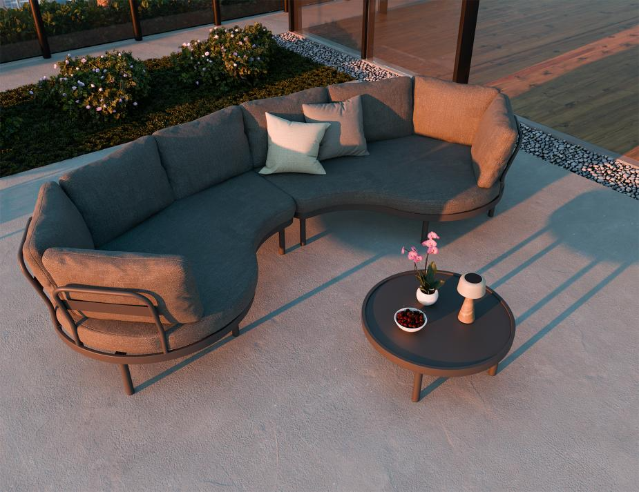 Outdoor patio set with a sectional sofa and coffee table on a concrete patio.