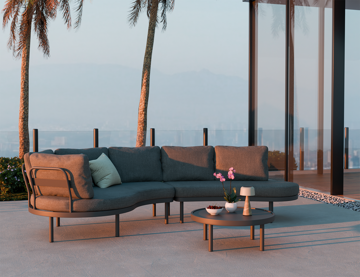 Outdoor patio set with a sectional sofa and coffee table in a tropical setting.