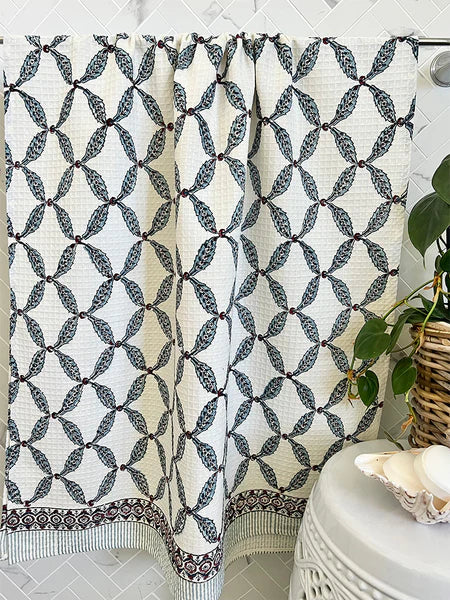 Patterned shower curtain with geometric design in a bathroom setting