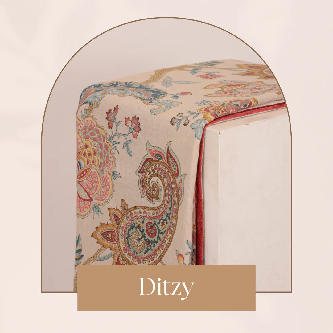 Decorative tablecloth with intricate paisley pattern on a neutral background, featuring the brand 'Ditzy'.