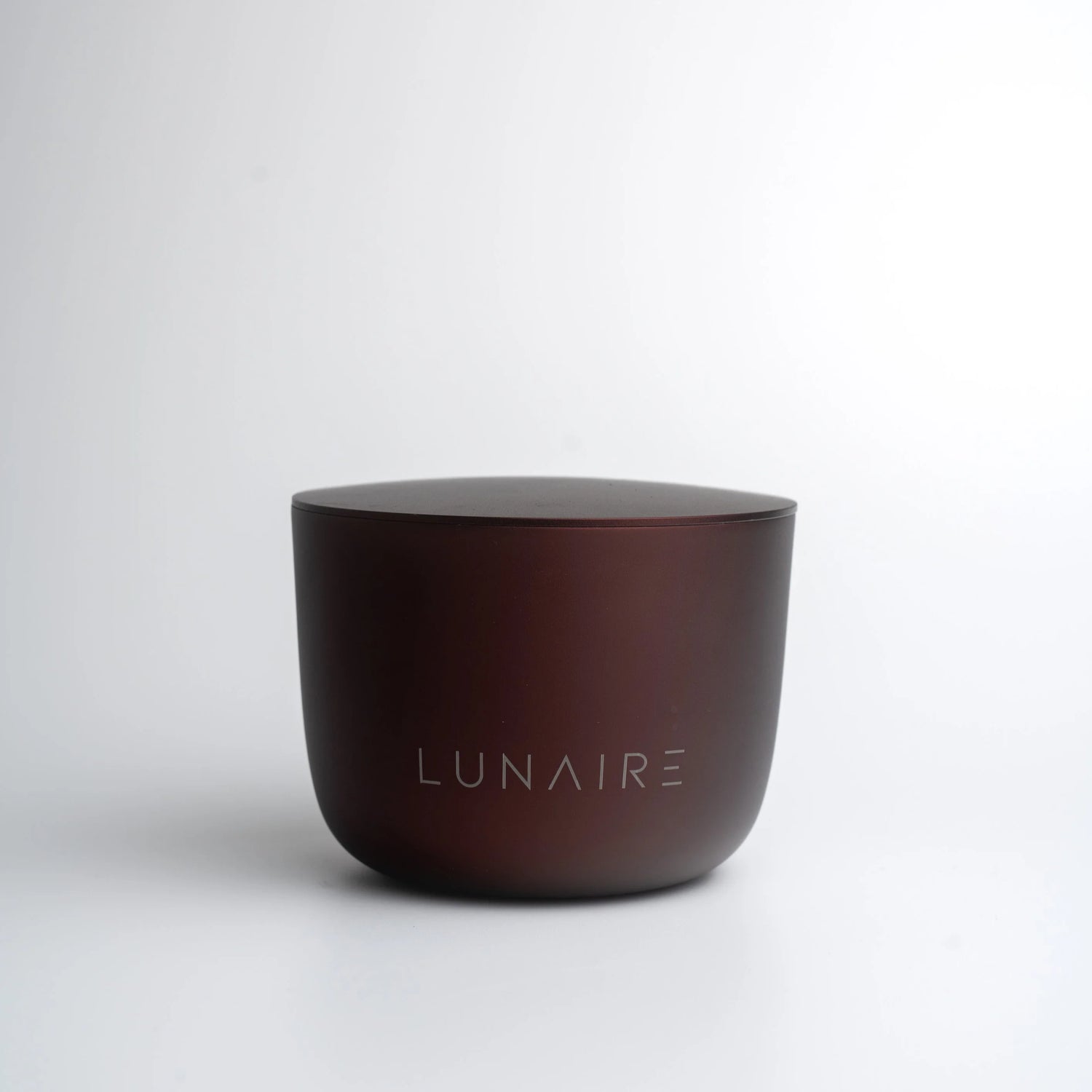 Brown ceramic cup with 'LUNAIRE' branding on a white background