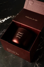 Red cosmetic container with 'forever jar' branding on a dark surface