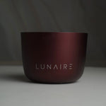 Dark red cup with 'LUNAIRE' branding on a gray background