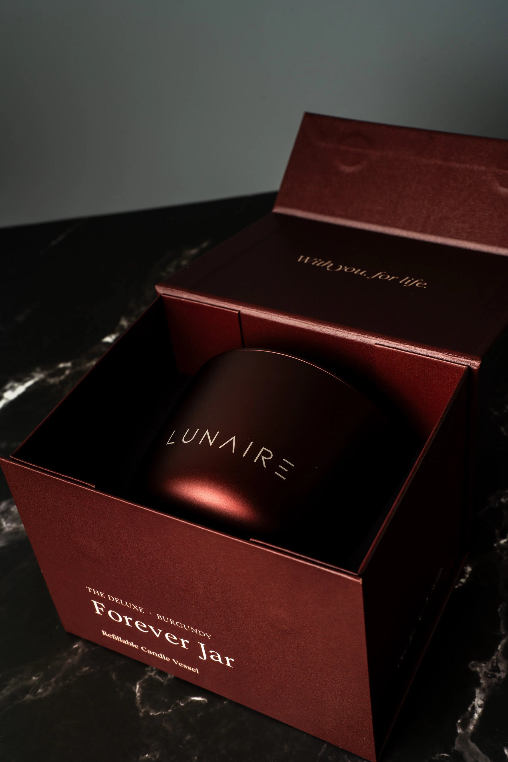 Lunaire product in a red box on a dark surface