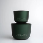 Two green containers with 'LUNAIRE' branding on a white background