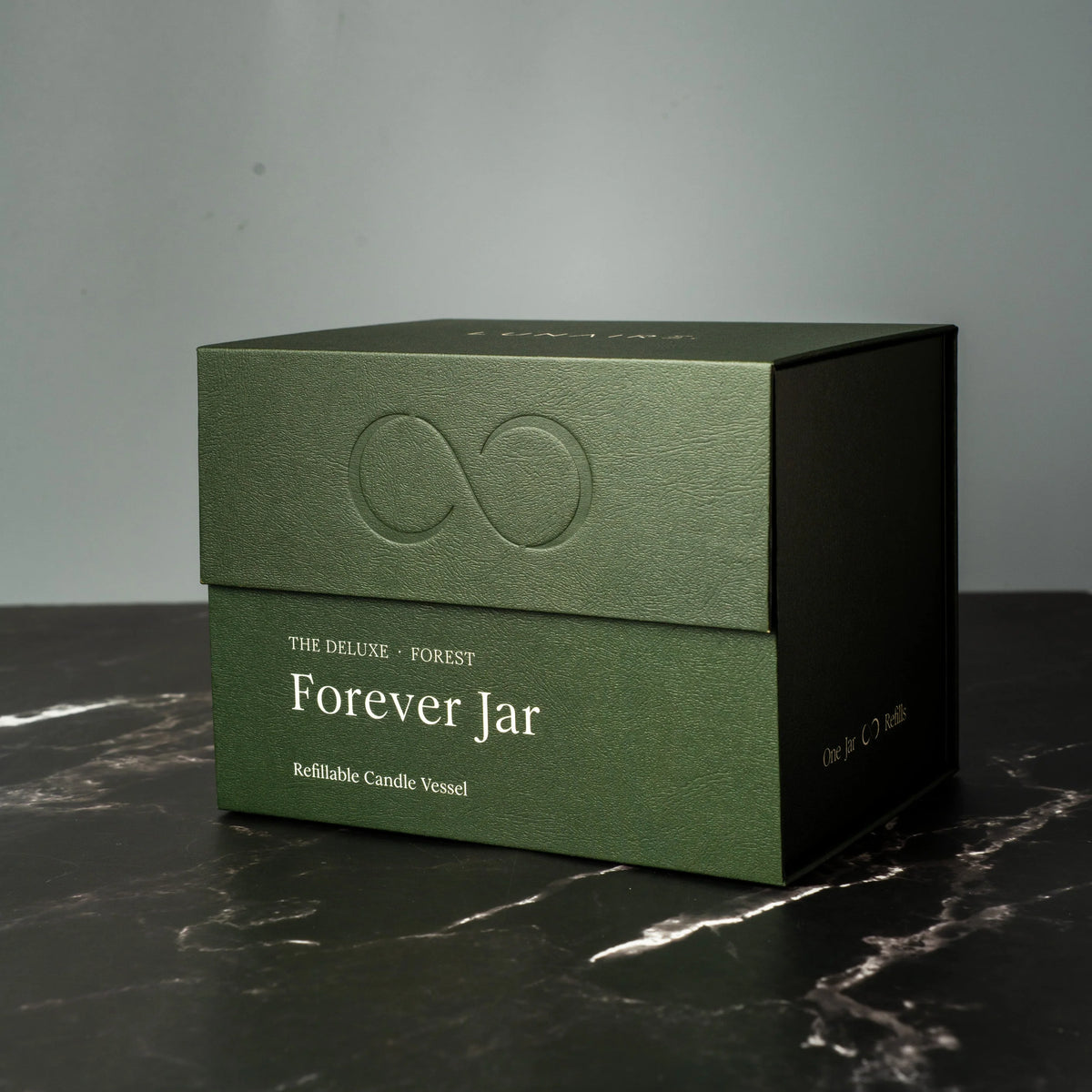 Green box with 'Forever Jar' text on a dark surface