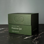 Green box with 'Forever Jar' text on a dark surface