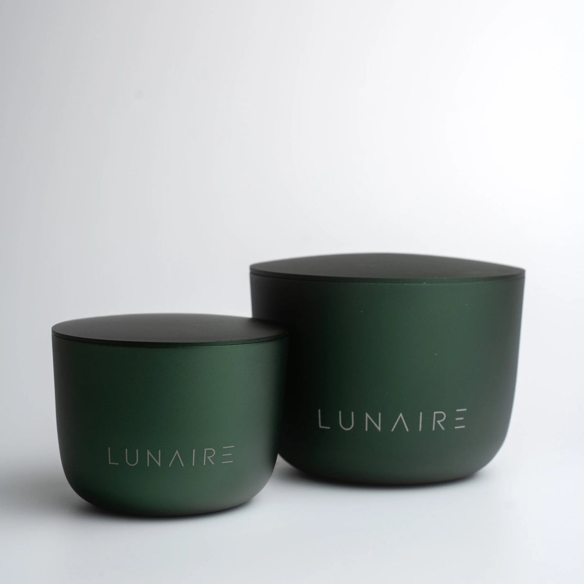 Two green containers with 'LUNAIRE' branding on a white background