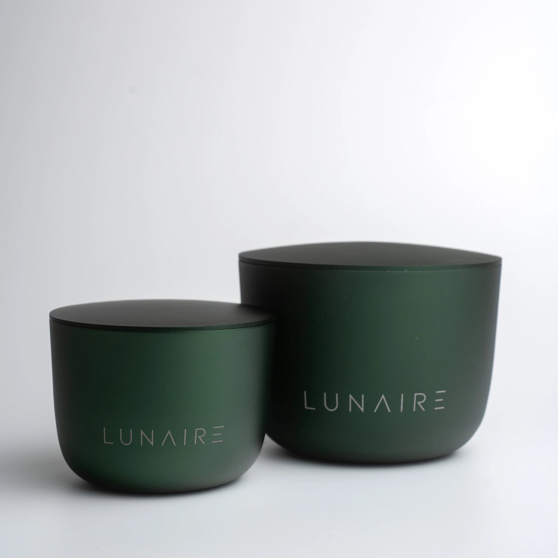 Two green containers with 'LUNAIRE' branding on a white background