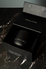 Black box with 'LUNAIRE' branding on a marble surface