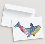 Colorful whale illustration on a card with a white envelope.