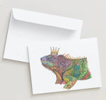 Colorful lizard illustration with a crown on a white card with an envelope.