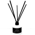 A reed diffuser bottle with a white glass base, black cap, and six black reeds, featuring a black label with white text that reads 'LUNA BLUE' and 'Lemon Zest - Bercandy - Lime'.