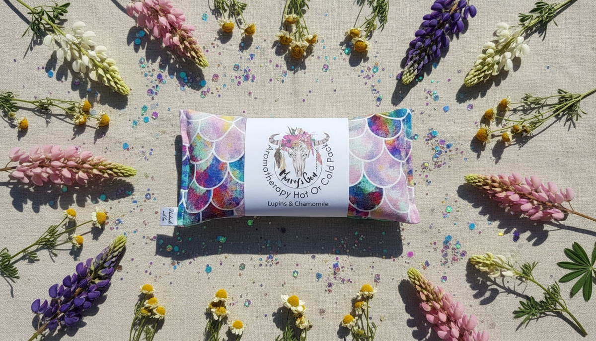 Colourful  heat pack surrounded by flowers on a textured surface