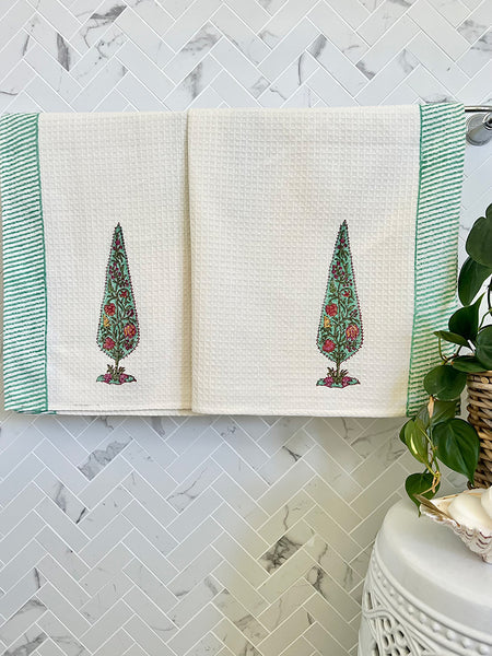 Open notebook with tree illustrations on a marble wall background