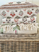 Stack of patterned towels on a wicker basket