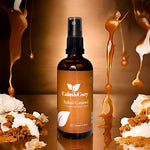 Brown bottle of Calm & Cozy Salted Caramel fragrance room spray with caramel and cake decorations.