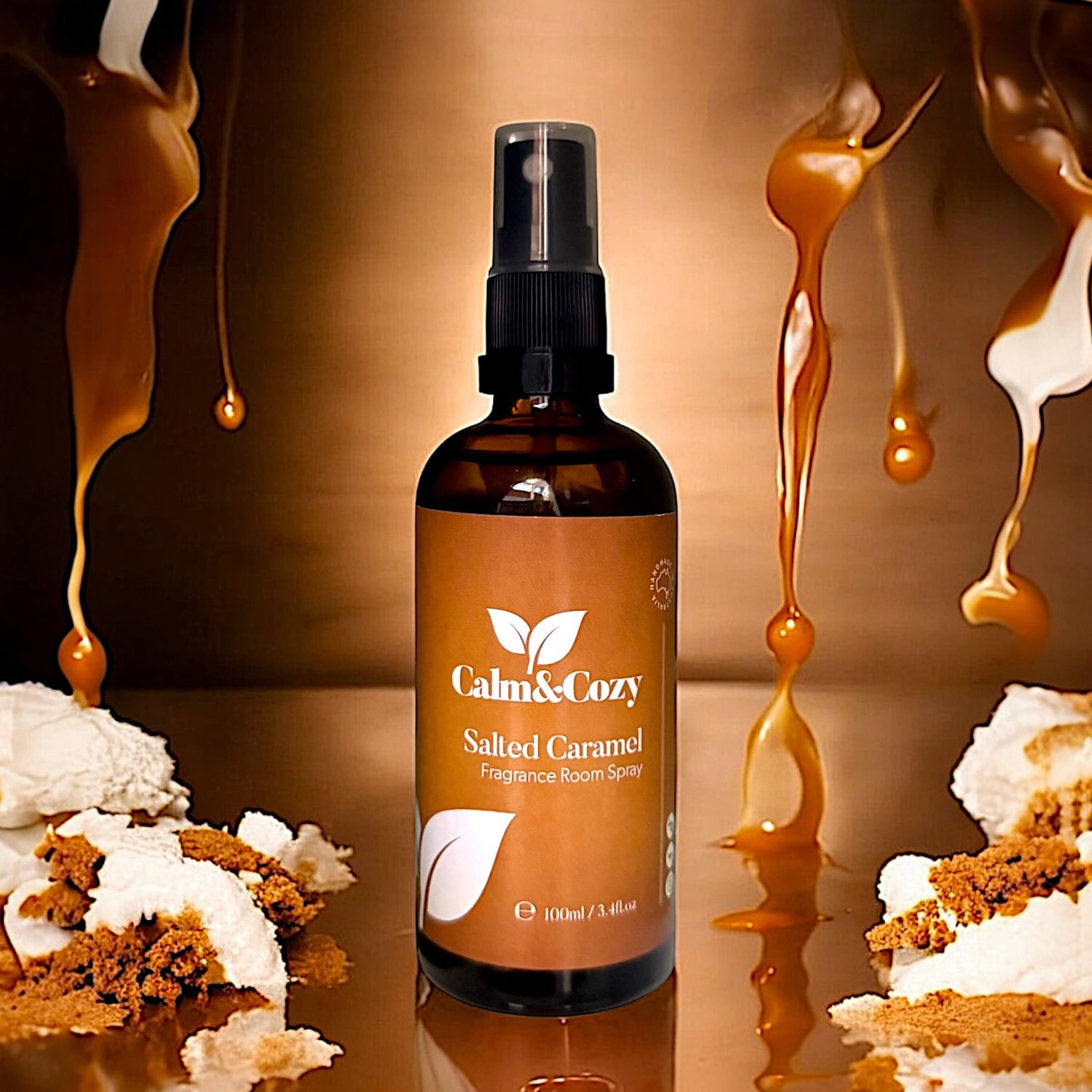 Brown bottle of Calm & Cozy Salted Caramel fragrance room spray with caramel and cake decorations.