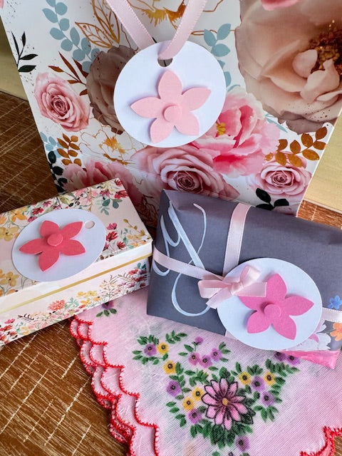 Decorative items with floral designs on a floral-patterned surface