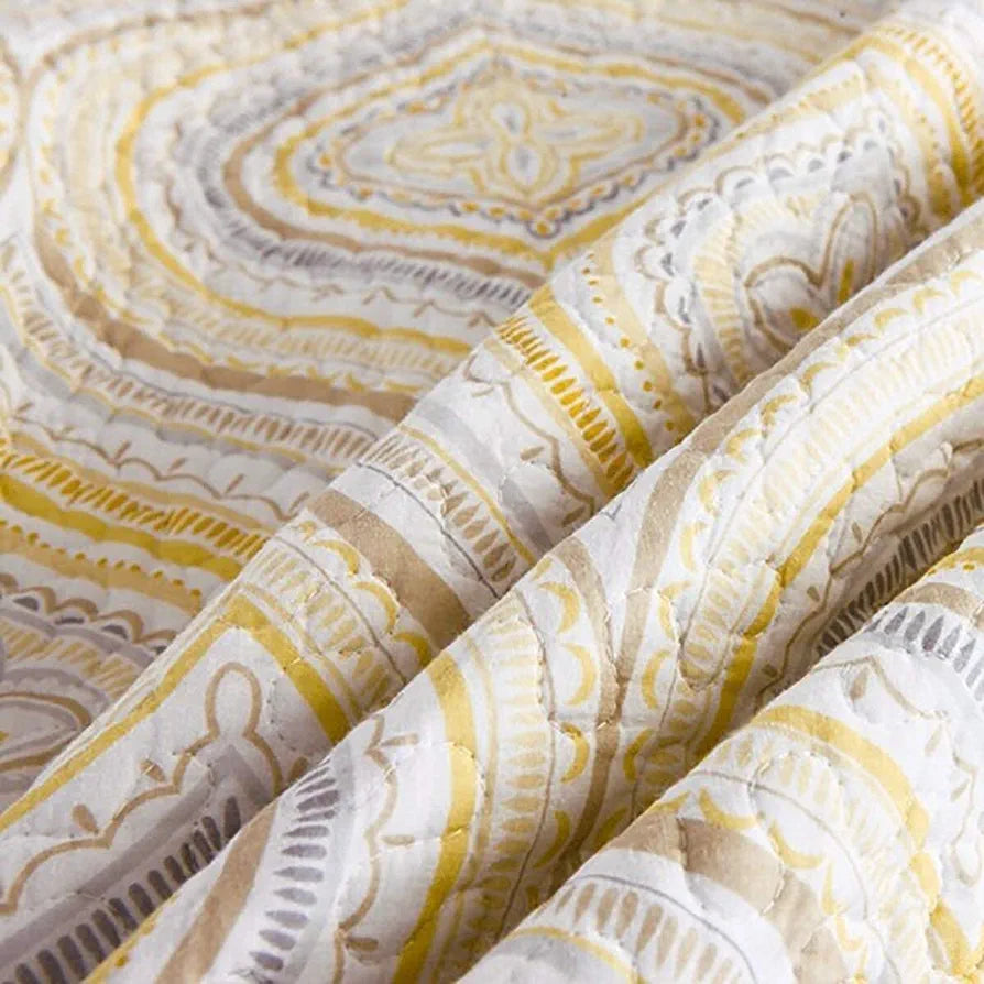 Close-up of patterned fabric with yellow and gray design