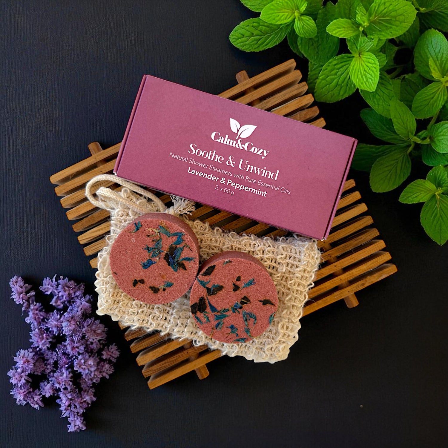 Calm & Cozy product packaging with lavender and peppermint elements on a dark background