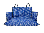 Blue car seat cover with white paw prints on a white background