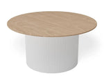 A round dining table with a light oak wood-grain top and a white fluted cylindrical pedestal base, shown on a clean white background.