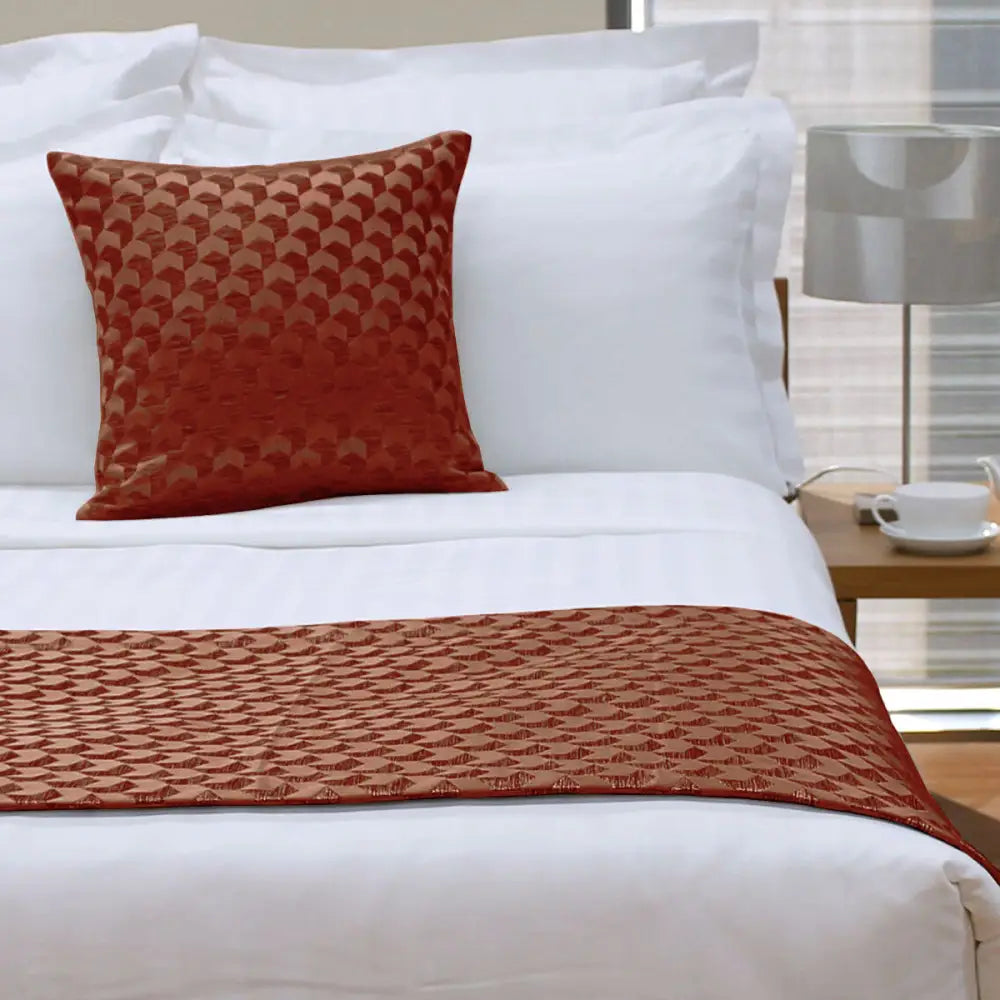Rust-colored Regency Russet Square Cushion with textured geometric pattern for stylish decor