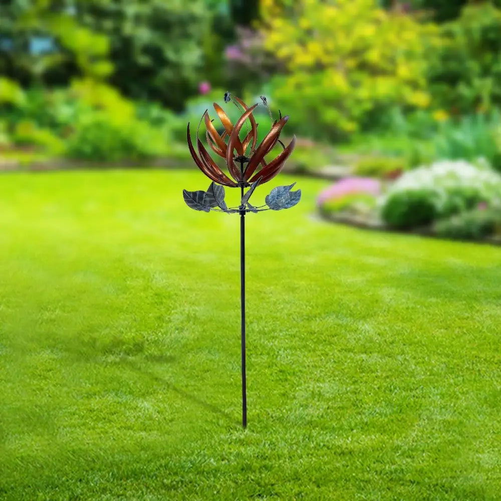 Lotus Wind Spinner featuring decorative metal blades and floral design elements