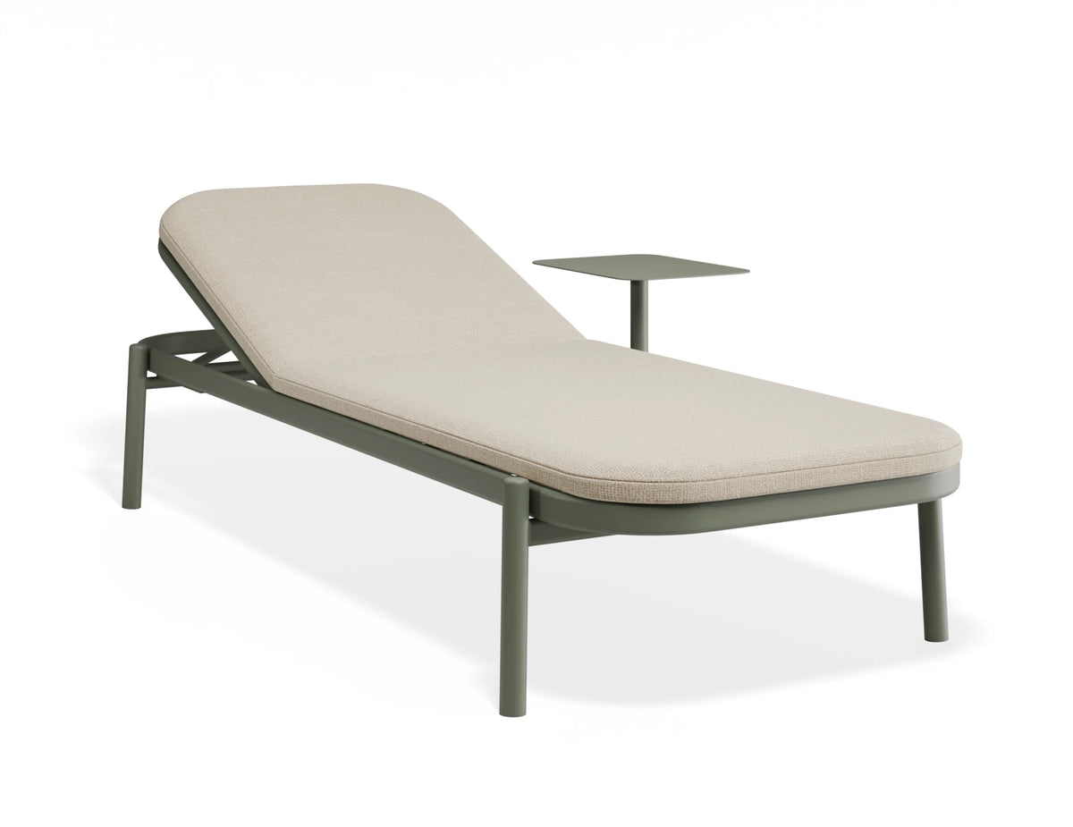 A modern outdoor chaise lounge chair with a light beige cushioned seat and backrest, supported by a dark gray metal frame with an integrated side table, shown on a white background.