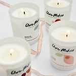 Clare Makes medium soy candle in a reusable gloss white glass jar with a branded dust cover
