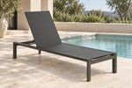Nerano charcoal sun lounge beside a pool