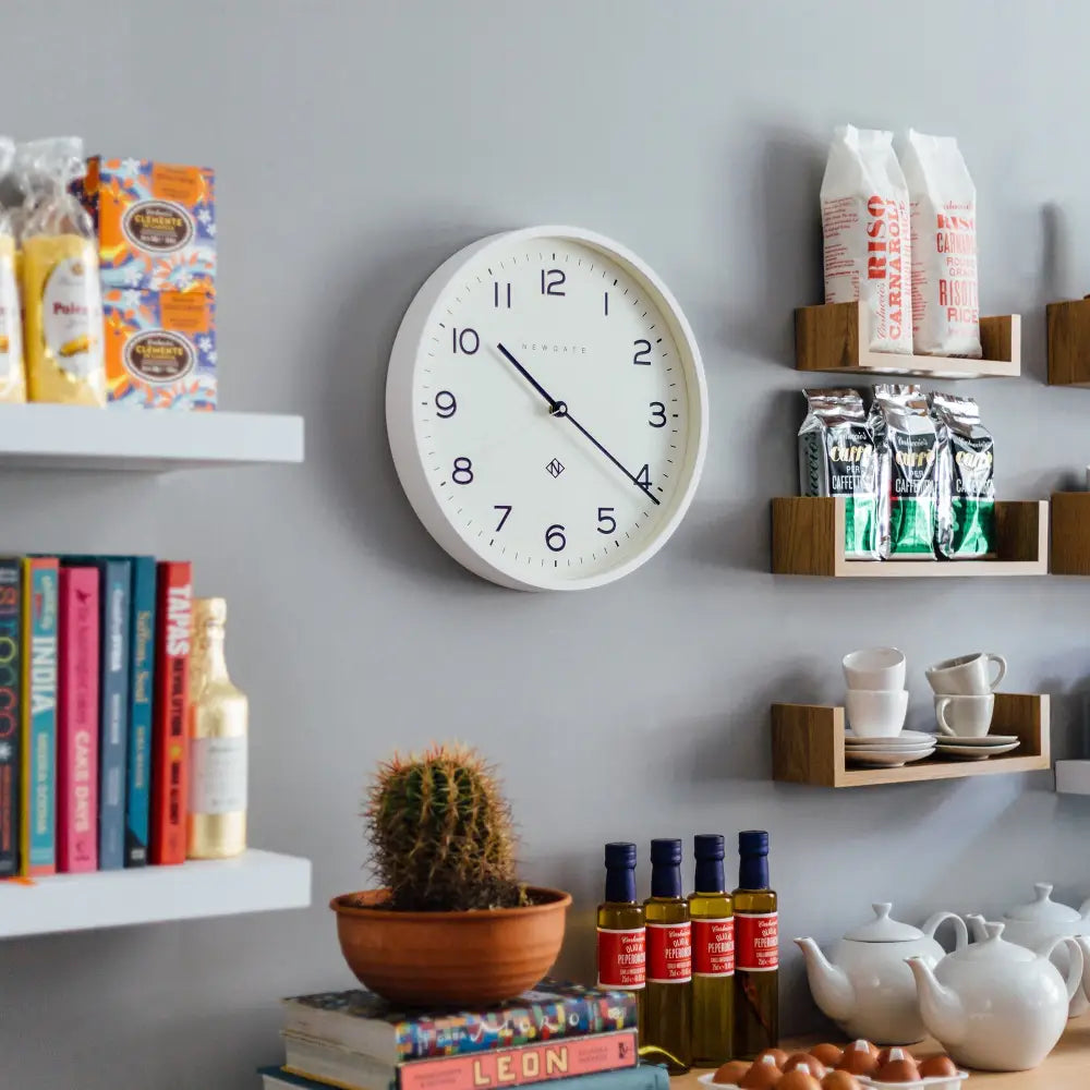 White analog Newgate Echo Clock Silicone with black numbers and hands