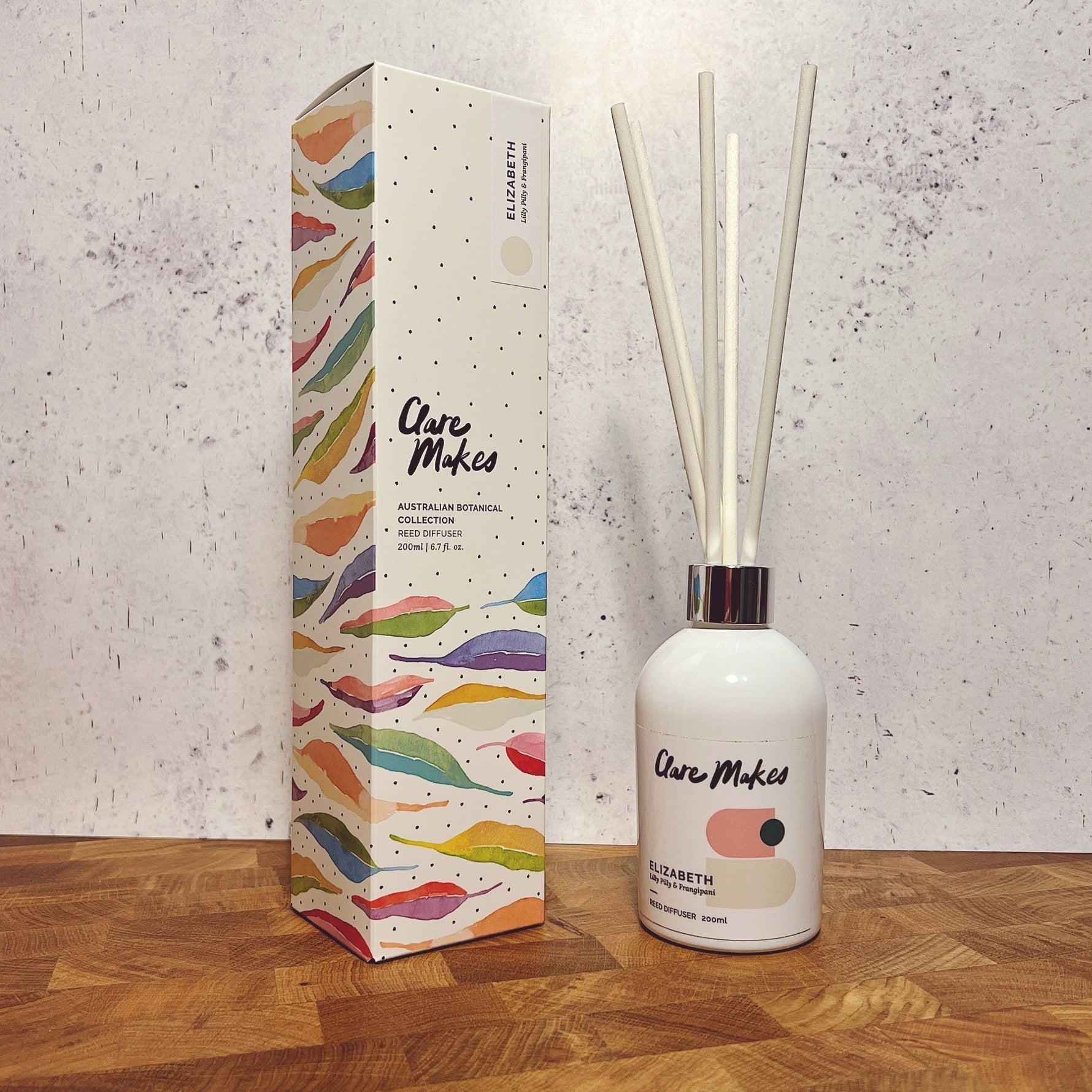 Clare Makes 200ml reed diffuser in a gloss white glass bottle with silver collar and white reeds
