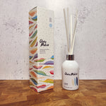 Clare Makes 200ml reed diffuser in a gloss white glass bottle with silver collar and white reeds