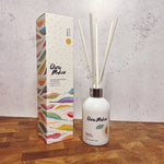 Clare Makes 200ml reed diffuser in a gloss white glass bottle with silver collar and white reeds
