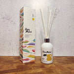 Clare Makes 200ml reed diffuser in a gloss white glass bottle with silver collar and white reeds