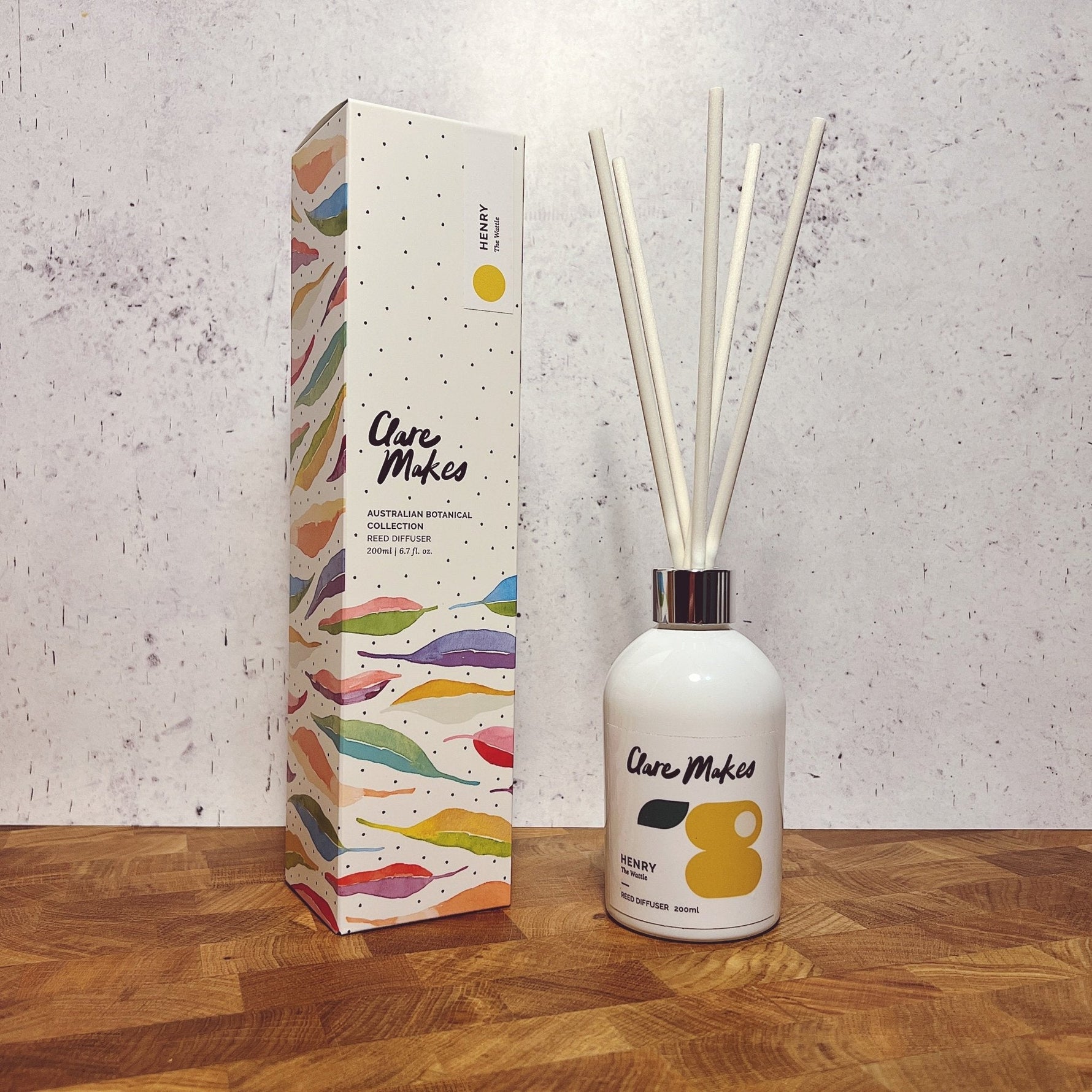 Clare Makes 200ml reed diffuser in a gloss white glass bottle with silver collar and white reeds
