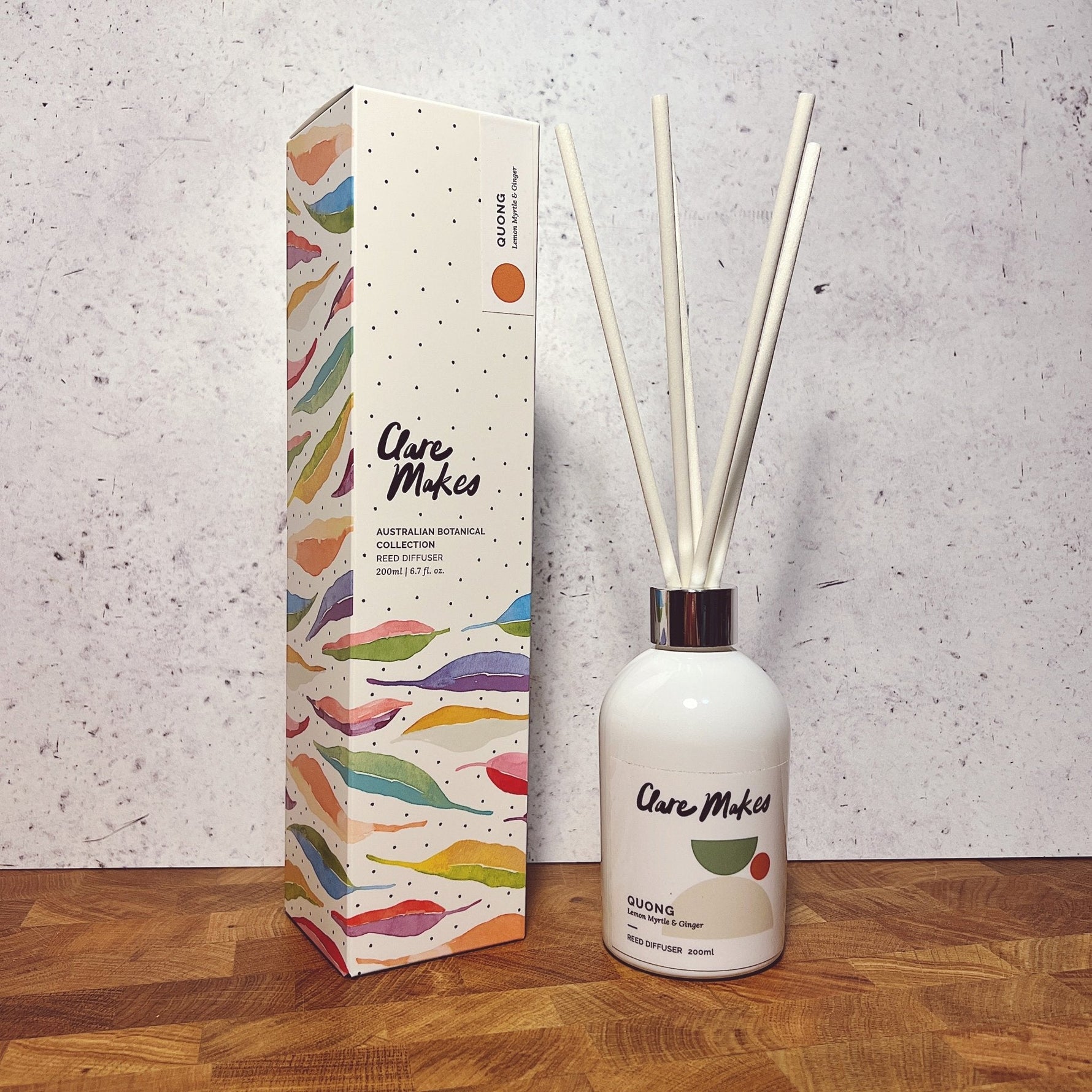 Clare Makes 200ml reed diffuser in a gloss white glass bottle with silver collar and white reeds