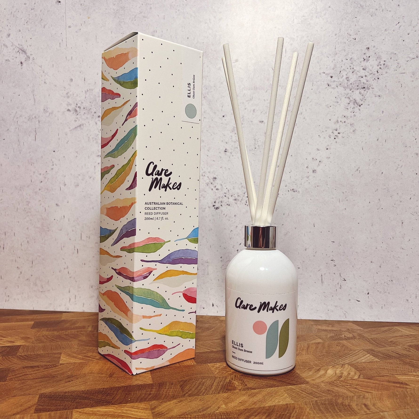 Clare Makes 200ml reed diffuser in a gloss white glass bottle with silver collar and white reeds